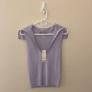 Woman’s sweater vest. Never been worn. Quality material.